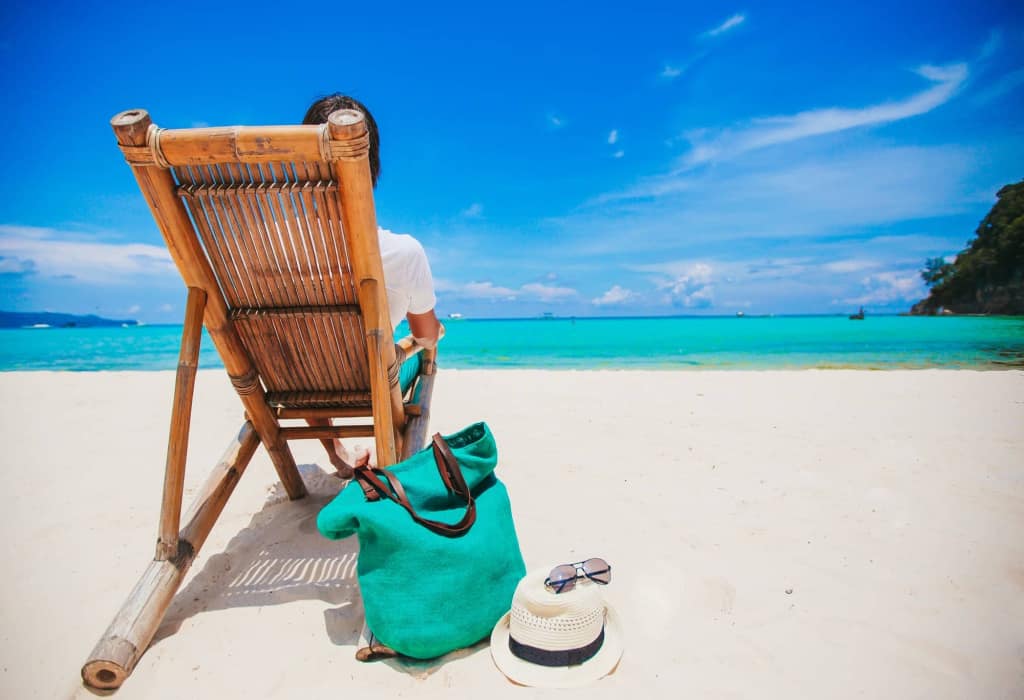 young-man-on-the-white-beach-on-vacation